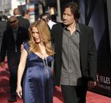 http://img220.imagevenue.com/loc36/th_85458_Gillian_Anderson-The_X_Files_I_Want_To_Believe_World_Premiere_in_Hollywood-01_122_36lo.JPG