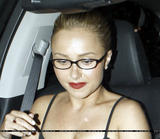 Hayden Panettiere shows cleavage wearing black low-cut top with bright red lipstick and glasess as she leaves a restaurant in LA