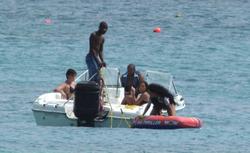 th_381034759_RihannaenjoysafunridewithfriendsonaboatinBarbados_160_122_783lo.jpg